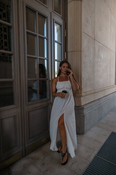 Woman White Dress Phone Building Entrance