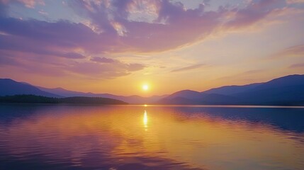   A stunning image of a tranquil lake bathed in sunlight with majestic mountain ranges reflected on its surface, framed by wispy clouds above