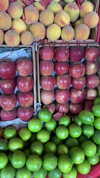 Beautiful View of a Fruit Shop Peaches Apples and Persian Limes