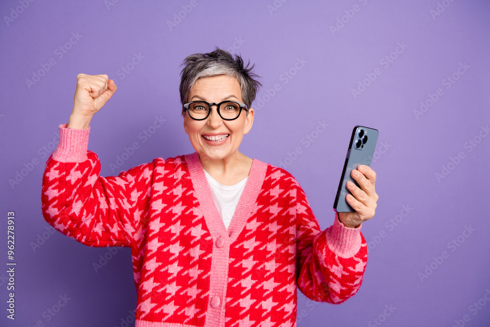 Sticker Photo portrait of lovely pensioner lady hold device winning dressed stylish red garment isolated on violet color background