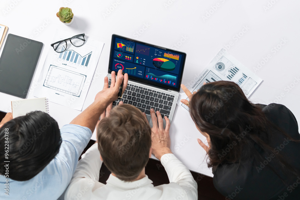 Leinwandbilder top view workspace of analyst team uses bi fintech display laptop to analyze financial data . busine