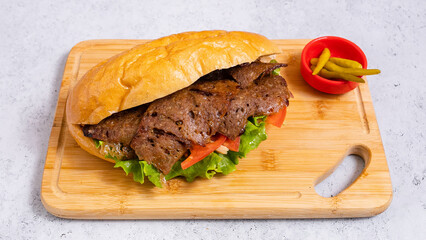 Delicious doner kebab on wooden tray