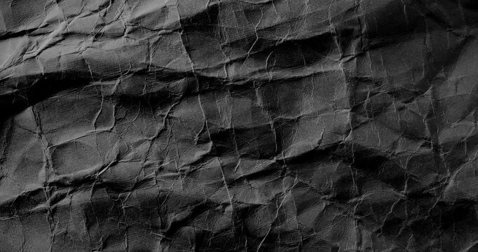Black crumpled texture surface. Seamless loop. Used as a background and texture.