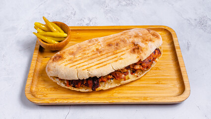 Delicious doner kebab on wooden tray