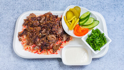 Delicious porion doner kebab with fries and vegetables