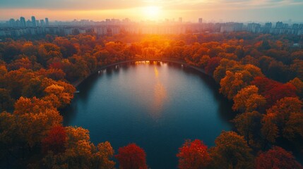 Autumn sunset over the lake, reflection of sunrays on the water