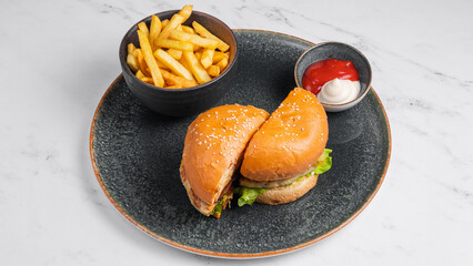 Delicious sliced burger and French fries