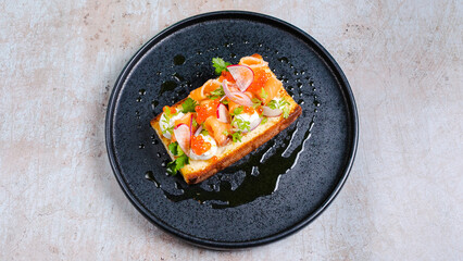 Bruschetta in black plate top view isolated