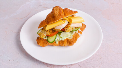 Croissant sandwich on plate
