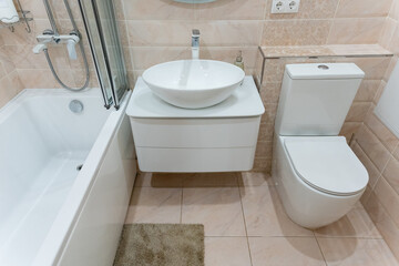 A bathroom that features a sink, a toilet, and a bathtub for use
