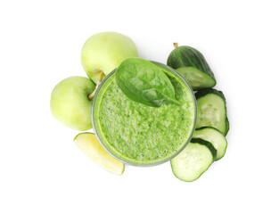 Tasty green smoothie in glass, lime, apples and cucumber isolated on white, top view