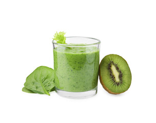 Tasty green smoothie in glass, spinach and half of kiwi isolated on white