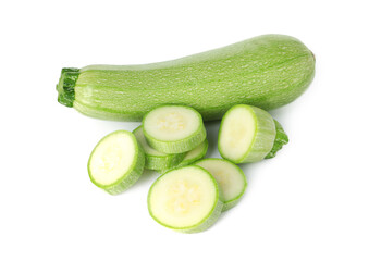 Fresh whole and cut zucchinis isolated on white, above view