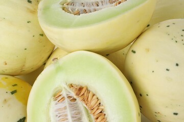 Fresh ripe honeydew melons as background, closeup
