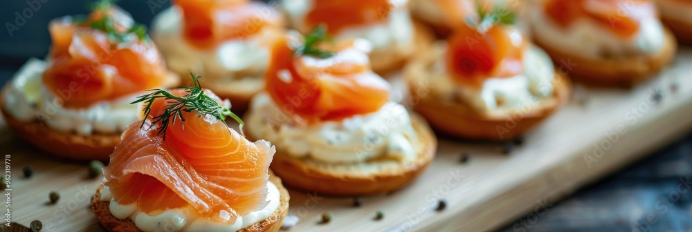 Canvas Prints Close-up of finger food appetizers featuring salmon and cream cheese on a wooden board.