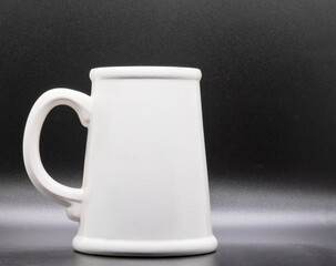 White stein drinking mug black background