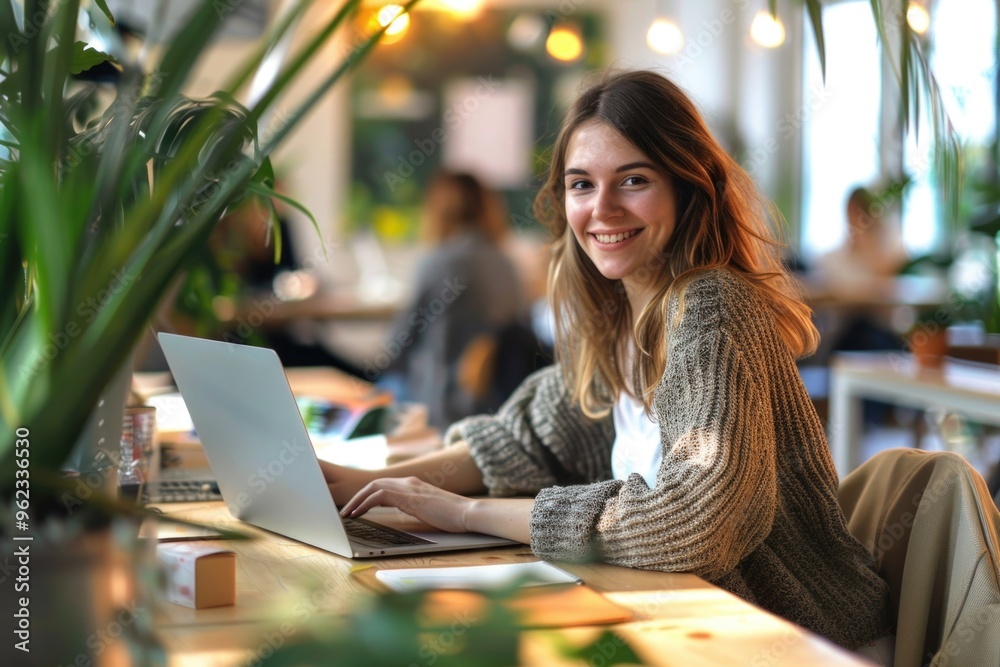 Poster a person sitting at a desk with a laptop open, possibly doing work or studying
