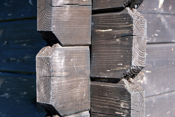 corner of a wooden gazebo built on the principle of a Russian hut