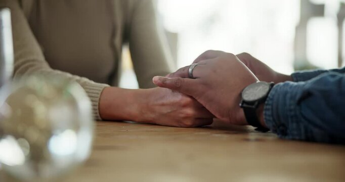 People, holding hands and conflict in home with stress, anxiety and frustrated woman. Couple, discussion and gesture at table for support, healing relationship and depression for infertility or fear
