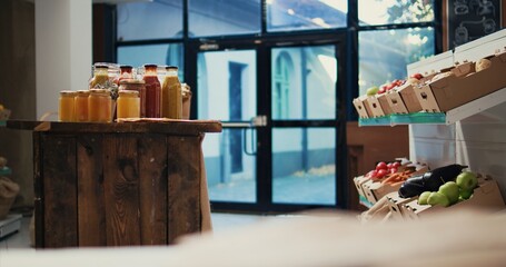 Low carbon footprint eco friendly farmers market business selling natural ripe produce and homemade sauces or spices. Neighborhood store filled with organic crops, pasta and grains. Handheld shot.