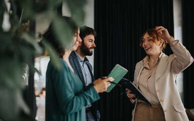 Creative professionals engaging in a thoughtful meeting, exchanging ideas in a contemporary workspace