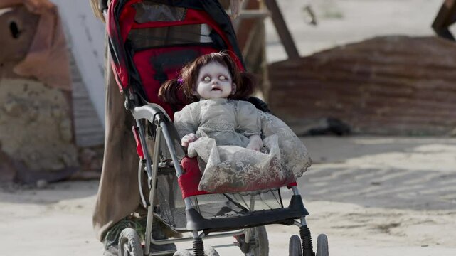 Horrifying zombie doll in stroller being run over by scary kart - slow motion