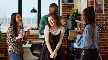 School colleagues organizing house wine party, enthusiastically dancing to disco music, tilt up shot. Friends enjoying time spent together, busting into skillful dance moves at social event