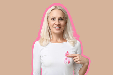 Mature woman with pink ribbon on beige background. Breast cancer awareness concept