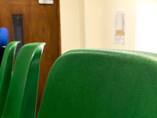 Colorful Chairs Aligned in a Classroom Setting Closeup