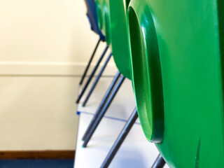 Colorful Chairs Aligned in a Classroom Setting Closeup