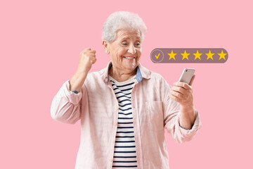 Happy senior woman using mobile phone on pink background - Powered by Adobe