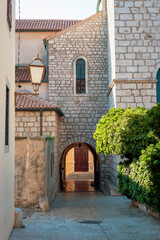 Fototapeta premium Steet passage view in old town of Krk, Krk island, Croatia