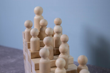 Time is money idea. time concept with business man trying to outrun time. Make things better - Improvement Concept. wooden figure - man climbing the steps to success in image over white background