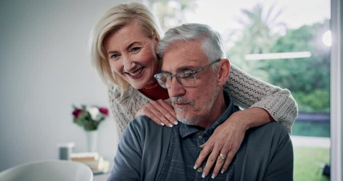 Laptop, hug and senior couple in home for remote work, support and talking in living room. Retirement, marriage and happy mature man and woman on computer for internet, website and online banking