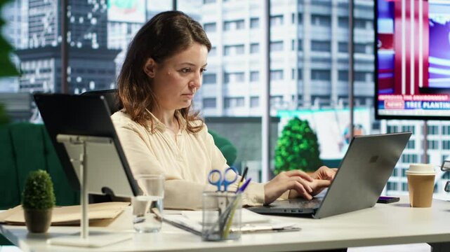 Ambitious businesswoman demonstrating her leadership skills, focusing on company growth, productivity and innovation. Leader setting a powerful example in the corporate environment. Camera A.