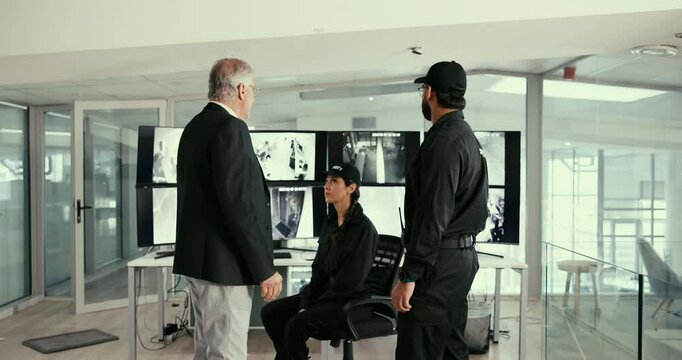 CCTV, handshake and supervisor talking to security staff in office for instructions, meeting or surveillance. Communication, computer screen and manager person shaking hands with monitoring team