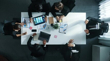 Top view of smart project manager use vr headset while business team discuss about marketing plan by using stock market graph from tablet and send data to virtual world. Technology. Directorate.