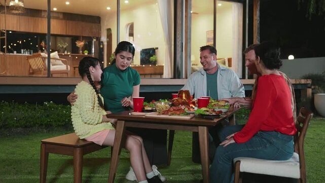 Family gather celebrate holiday. Parents, grandparents and girl together to talk and have dinner party food. Outdoor activity for spending time with cute relatives cross generation gap. Divergence.