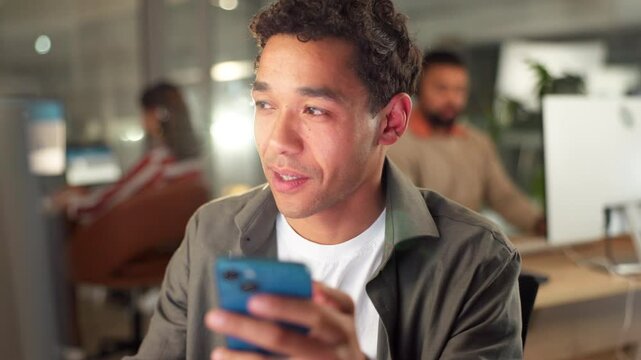 Phone, typing and business man check article, proofreading or review in startup. Mobile, smile and creative on chat app for update, information or editing comparison for blog or copyright on computer