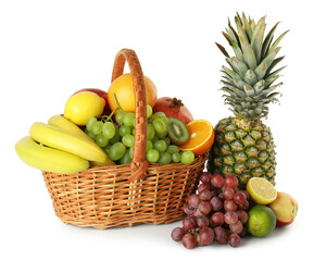 Many fresh ripe fruits in basket isolated on white