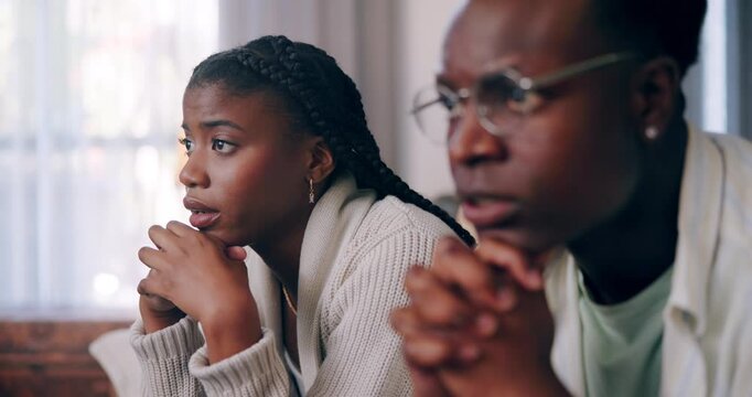 Horror, nervous and watching tv with black couple on sofa for streaming service, subscription and date night. Relax, marriage and movie with man and woman at home for broadcast, show and film media