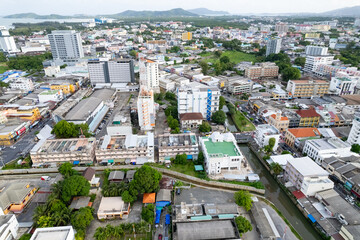 Aerial view of residential houses and driveways neighborhood during a sunny time.Tightly packed homes.Top view over building houses in phuket city thailand