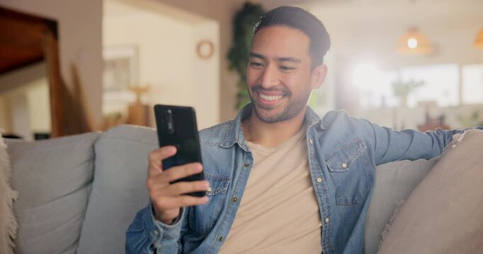 Phone, relax and smile with man on sofa in living room of home to browse or search dating app. Break, communication and social media with happy person in apartment for morning subscription streaming