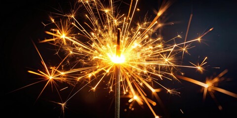 Burning sparkler glowing brightly on a dark background, sparkler, burning, brightness, glow, celebration, holiday