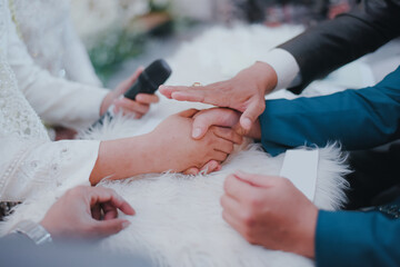 Shaking hand on Islamic prenuptial agreement. Indonesian&rsquo;s wedding, akad nikah