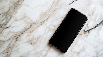 A smartphone lies on a white marble surface with its screen turned off.