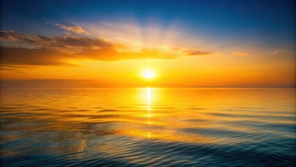 Obraz premium Yellow sunset illuminating the calm sea waters in a peaceful and tranquil scene, sunset, sea, yellow, orange, horizon, reflections