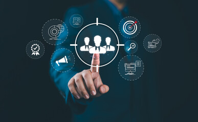 Digital marketing targeting concept. Businessman with marketing icons represent targeting, customer engagement. global reach, Modern strategies in online marketing, customer acquisition, sales growth,