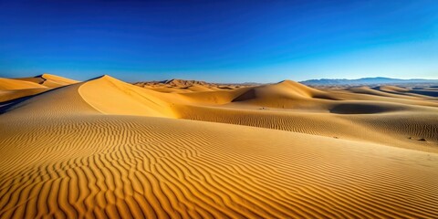 Naklejka premium Desert landscape with smooth sand dunes under a clear blue sky, Sand, dunes, desert, landscape, nature, arid, dry, hot