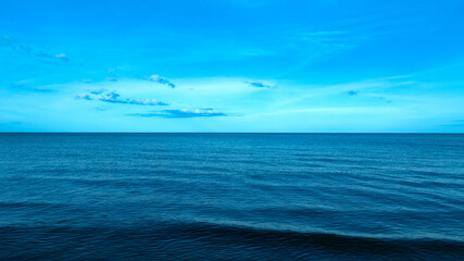 Nature of the beach and sea Summer with sunshine, sandy beaches, clear blue waters sparkling against the blue sky. On an island with good ecology and environment Background for summer vacation concept